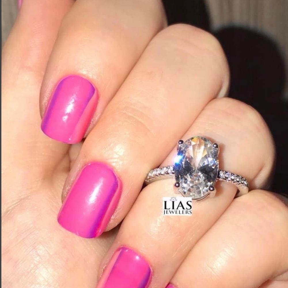 New 18k white gold engagement ring oval